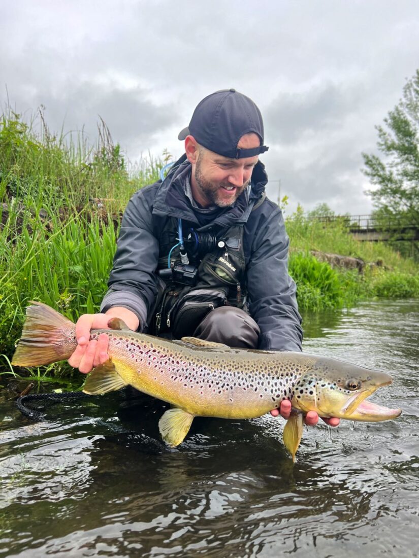 Fly fishing at the river big trout